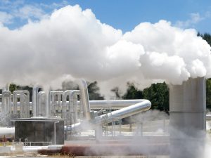 Geothermal enery plant, clouds of steam from chimeney