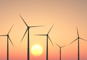 Sunset image with sun and wind turbine silhouettes