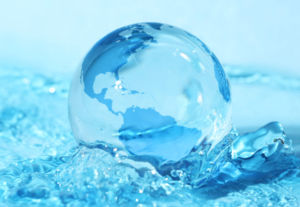 glass world globe in blue water