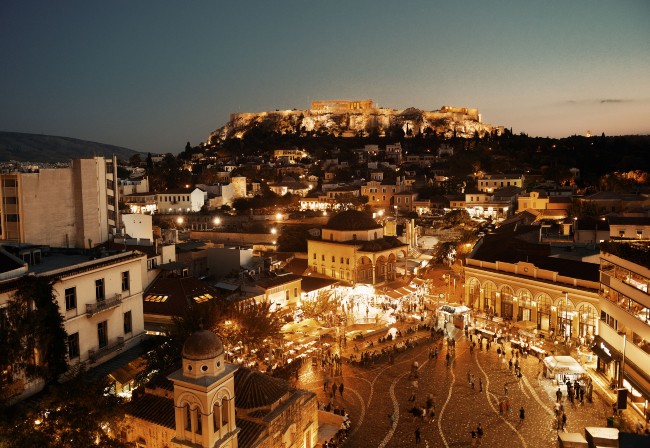 night image of Athens with historic area at fore and Acropolis in background