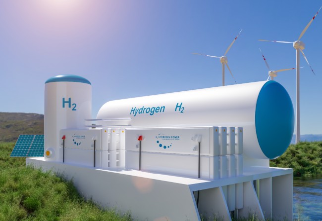 White and blue hydrogen tank, with solar panel and wind turbines in the background